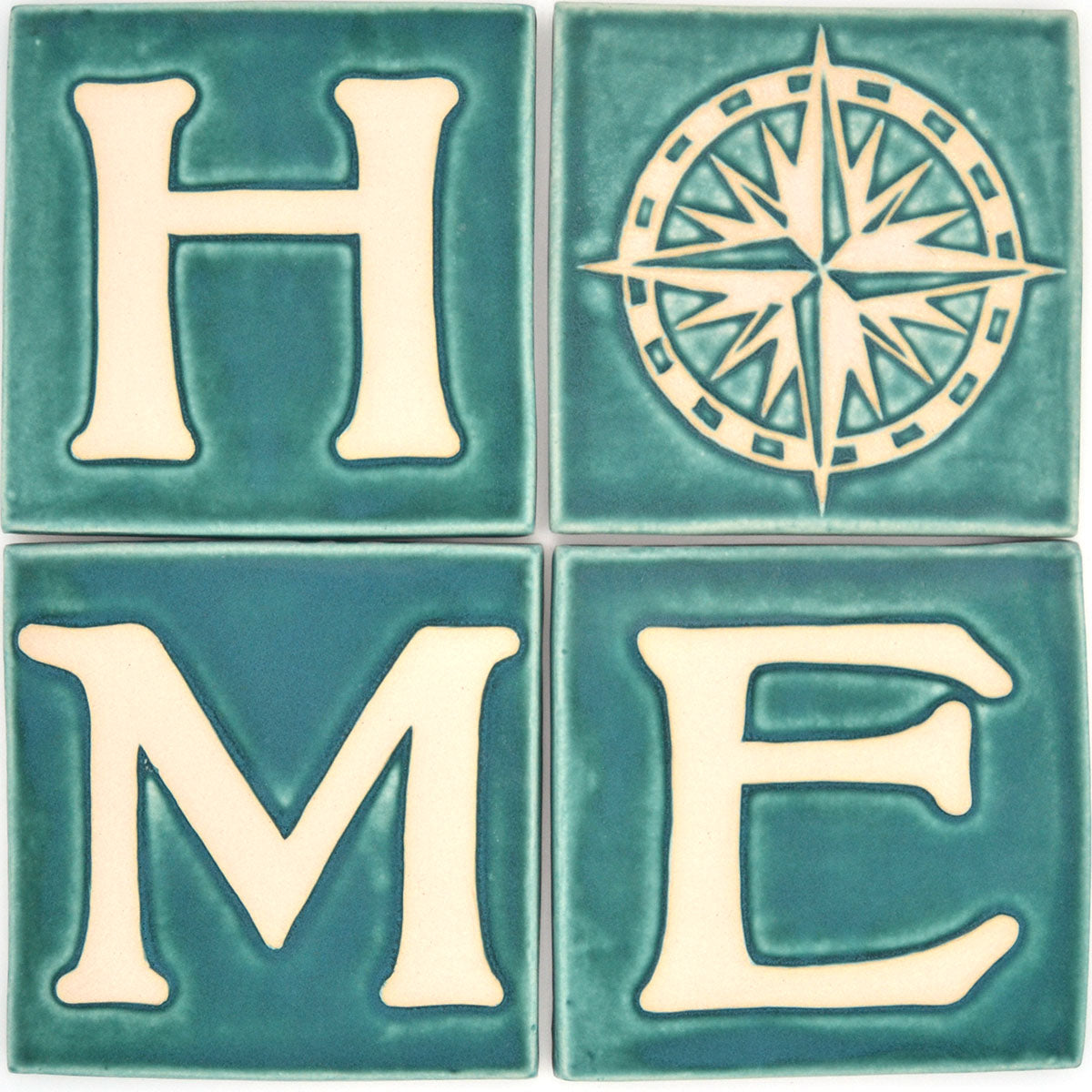 four tile set spelling home with compass